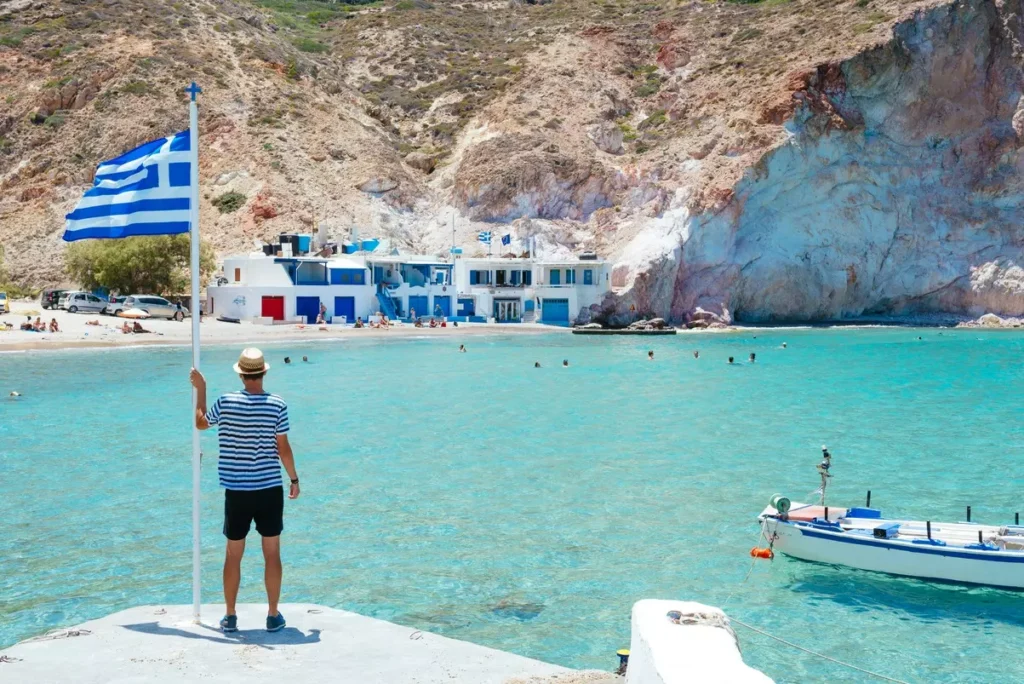 greece-milos-firopotamos-beach-man-looking-at-s-2024